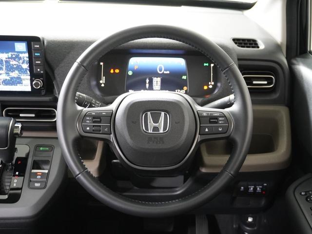 フリード エアーＥＸ　１オ－ナ－ナビＤレコＲカメＥＴＣ両電扉ＢＴ地デジ　渋滞追従クルーズ　Ｂｌｕｅｔｏｏｔｈ　障害物センサー　シートヒーター　ブラインドスポット　オートハイビーム　１５インチ純正アルミホイール　禁煙車（10枚目）