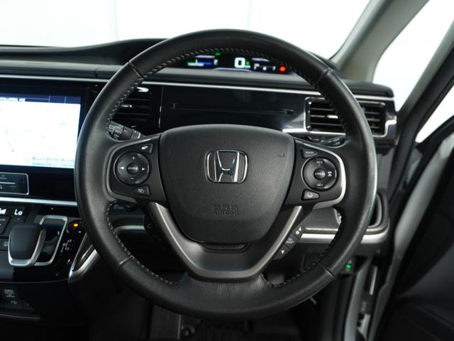 ステップワゴンスパーダ スパーダハイブリッドG・EXホンダセンシング 〇ナビ 後席モニタ 全周囲カメ ETC2.0 両電扉 BT 地デジ ドアバイザー わくわくゲート 三列シート 後席シェード シートヒーター 合皮コンビシート ウインカーミラー インテリア内装ブラック(9枚目)