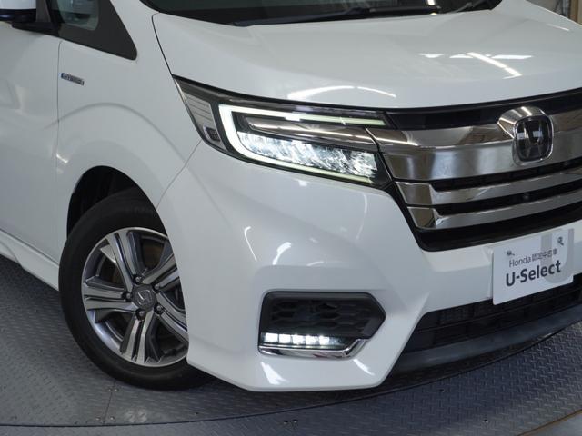 ステップワゴンスパーダ スパーダハイブリッドG・EXホンダセンシング 〇ナビ 後席モニタ 全周囲カメ ETC2.0 両電扉 BT 地デジ ドアバイザー わくわくゲート 三列シート 後席シェード シートヒーター 合皮コンビシート ウインカーミラー インテリア内装ブラック(35枚目)