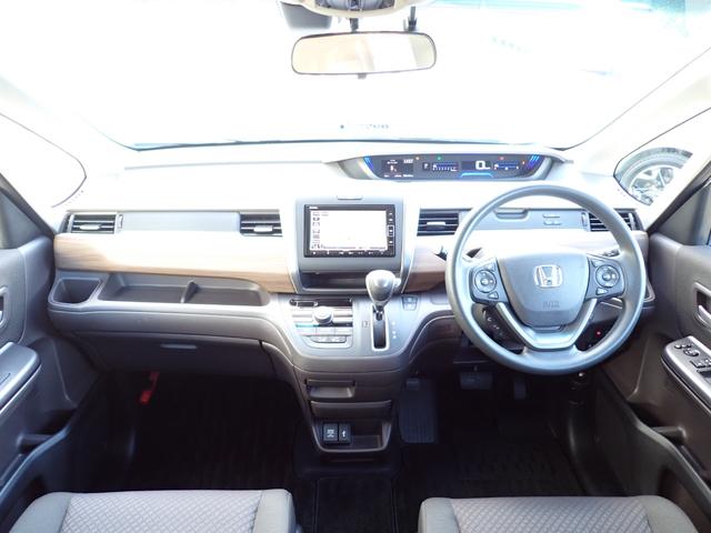 フリード Ｇ・ホンダセンシング　１オーナー　禁煙　６人乗り　７インチ純正ナビ　前後ドラレコ駐車録画　ＴＶキット　ＥＴＣ　両側電動スライドドア　ＤＶＤ　ＣＤ録音　ＢＴ　ＵＳＢ　シートヒーター　Ｒカメラ　オートライト　ヒーテッドミラー（6枚目）