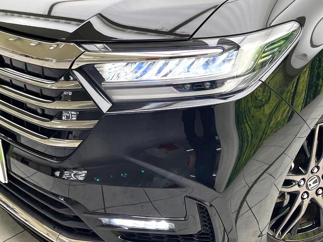 オデッセイハイブリッド ｅ：ＨＥＶアブソルート・ＥＸ　後席モニター　純正１０インチナビ　全周囲カメラ　両側電動ドア　電子パーキング　ホンダセンシング　ＬＥＤヘッド　ＥＴＣ２．０　ドラレコ　電動リアゲート　Ａｐｐｌｅ　ＣａｒＰｌａｙ　シートヒーター　禁煙車（13枚目）