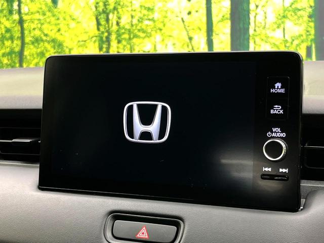ヴェゼル ｅ：ＨＥＶ　Ｘ　純正９型ナビ　禁煙車　バックカメラ　ホンダセンシング　パドルシフト　スマートキー　ワイヤレス充電器　コーナーセンサー　純正１６インチアルミ　オートエアコン　オートブレーキホールド　ＥＴＣ（3枚目）