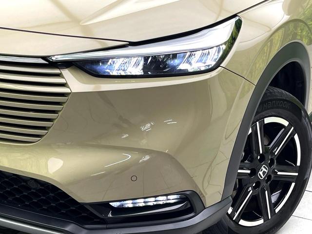 ヴェゼル ｅ：ＨＥＶ　Ｘ　純正９型ナビ　禁煙車　バックカメラ　ホンダセンシング　パドルシフト　スマートキー　ワイヤレス充電器　コーナーセンサー　純正１６インチアルミ　オートエアコン　オートブレーキホールド　ＥＴＣ（12枚目）