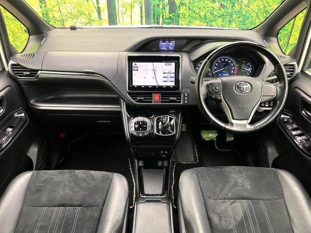 エスクァイア ハイブリッドGiプレミアムパッケジブラックテーラード 禁煙車 純正9型ナビ バックカメラ シートヒーター 両側電動スライドドア LEDヘッド セーフティセンス 純正15インチアルミ スマートキー ETC オートエアコン クルコン オートライト(2枚目)