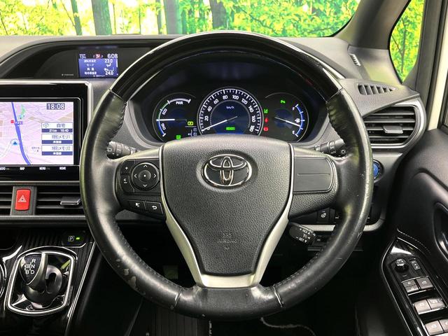 エスクァイア ハイブリッドGiプレミアムパッケジブラックテーラード 禁煙車 純正9型ナビ バックカメラ シートヒーター 両側電動スライドドア LEDヘッド セーフティセンス 純正15インチアルミ スマートキー ETC オートエアコン クルコン オートライト(11枚目)