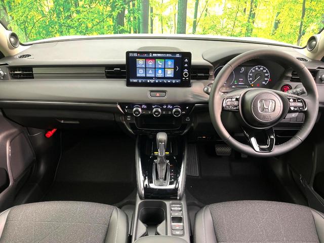 ヴェゼル e:HEV Z 登録済未使用車 9インチホンダコネクトディスプレイ 全周囲カメラ ETC2.0 電動リアゲート パドルシフト LEDヘッド フルセグTV 置くだけ充電 スマートキー シートヒーター オートライト(2枚目)