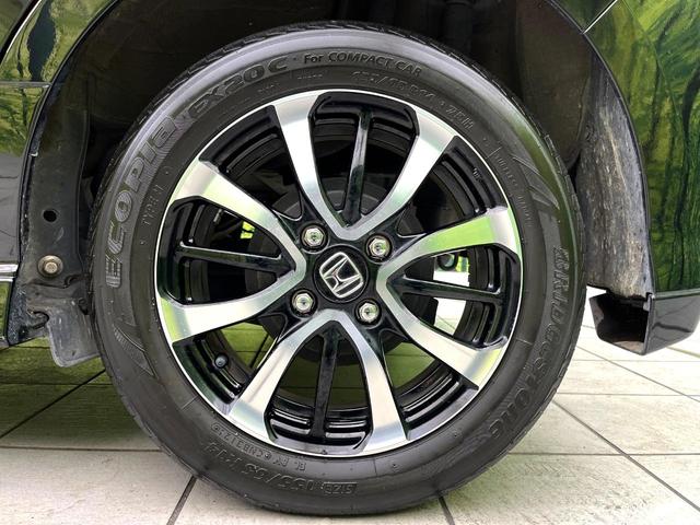 N-BOXカスタム G・Lホンダセンシング 禁煙車 純正ナビ バックカメラ アダプティブクルーズコントロール パワースライドドア 車線逸脱警報 LEDヘッド 純正14インチアルミホイール 横滑り防止装置 ETC スマートキー(56枚目)