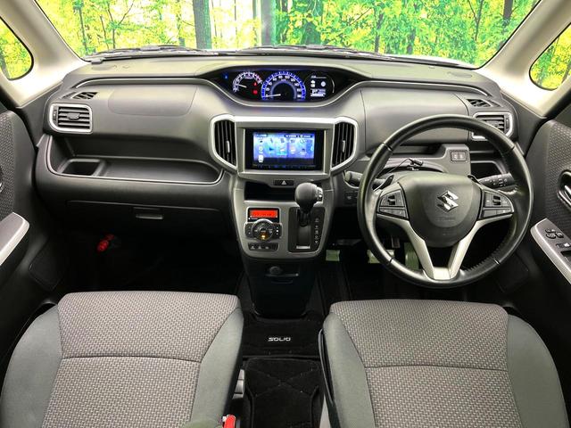 ソリオ ハイブリッドＭＺ　禁煙車　ナビ　バックカメラ　両側パワースライドドア　スズキセーフティー　レーダークルーズコントロール　ＨＩＤライト　フォグランプ　純正１５インチアルミホイール　プッシュスタート　後席シェード（2枚目）