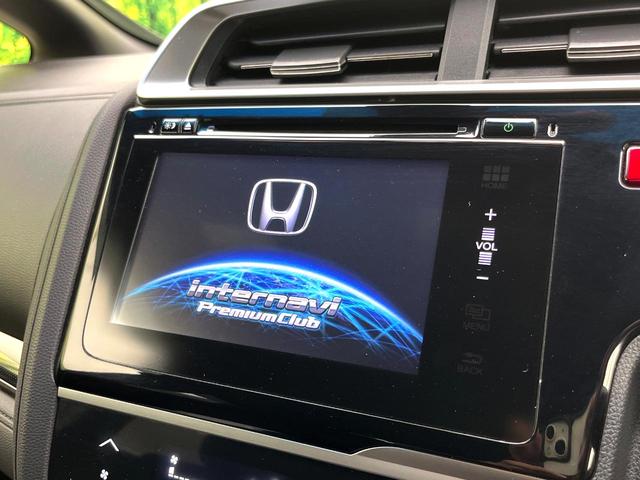 フィットハイブリッド Ｓパッケージ　禁煙車　純正ナビ　バックカメラ　衝突軽減ブレーキ　クルコン　スマートキー　ＨＩＤヘッド　純正１６インチアルミ　オートライト　オートエアコン　パドルシフト　ＥＴＣ　ＢＬＵＥＴＯＯＴＨ（3枚目）