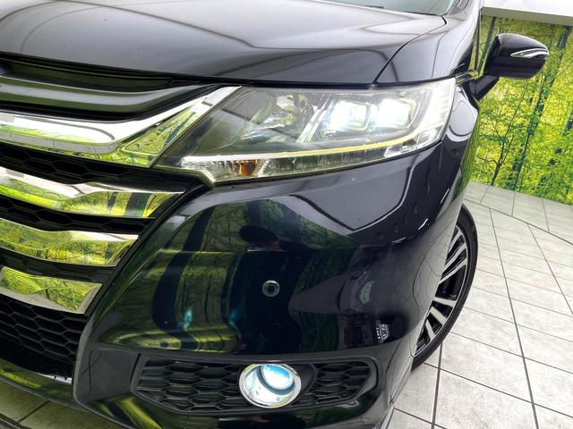 オデッセイ アブソルート・ＥＸ　禁煙車　純正ナビ　フリップダウンモニター　衝突軽減ブレーキシステム　両側電動スライドドア　ＨＩＤヘッド　クルコン　純正１８インチアルミ　パドルシフト　パワーシート　ＥＴＣ　スマートキー（12枚目）