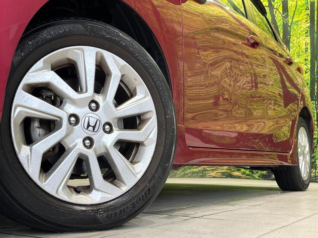 フィット 13G・S ホンダセンシング 純正SDナビ バックカメラ ホンダセンシング レーダークルーズ 禁煙車 ドラレコ スマートキー LEDヘッド ETC 車線逸脱警報 オートライト オートエアコン 純正15インチアルミ(10枚目)