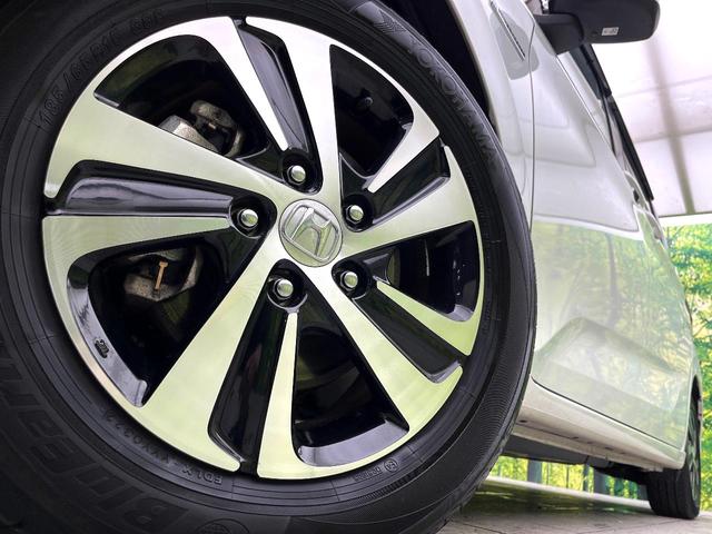 フリードハイブリッド ハイブリッド・ＥＸ　禁煙車　純正９型ナビ　アダプティブクルーズコントロール　バックカメラ　両側パワースライドドア　ＬＥＤヘッドライト　純正１５インチアルミ　スマートキー　オートエアコン　ドライブレコーダー　ＥＴＣ（14枚目）