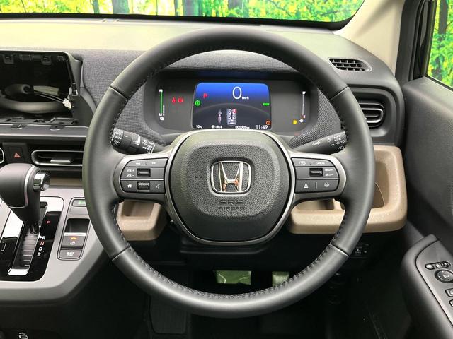 フリード ｅ：ＨＥＶエアー　ＥＸ　登録済未使用車　ホンダセンシング　両側電動スライドドア　シートヒーター　アダプティブクルーズコントロール　ＬＥＤヘッド　オートエアコン　オートライト　純正１５インチアルミ　電動パーキングブレーキ（11枚目）