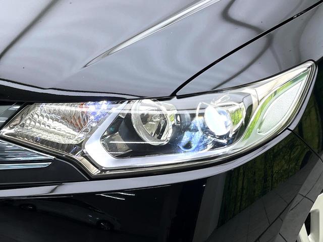 フィットハイブリッド Ｌパッケージ　禁煙車　純正８型ナビ　バックカメラ　ドライブレコーダー　ＥＴＣ　ハーフレザーシート　スマートキー　ＬＥＤヘッドライト　純正１５インチアルミホイール　ステアリングスイッチ　オートエアコン（11枚目）