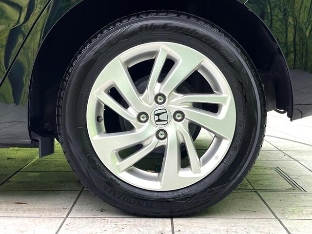 フィットハイブリッド Ｌパッケージ　禁煙車　純正８型ナビ　バックカメラ　ドライブレコーダー　ＥＴＣ　ハーフレザーシート　スマートキー　ＬＥＤヘッドライト　純正１５インチアルミホイール　ステアリングスイッチ　オートエアコン（43枚目）