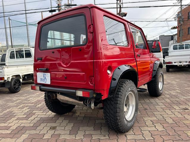 ジムニー 4WD ターボ ETC ドラレコ 社外15インチアルミ M/Tタイヤ リフトアップ 社外マフラー 社外ステアリング 社外F.Rバンパー(4枚目)