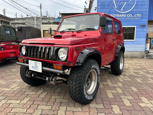 ジムニー 4WD ターボ ETC ドラレコ 社外15インチアルミ M/Tタイヤ リフトアップ 社外マフラー 社外ステアリング 社外F.Rバンパー(8枚目)