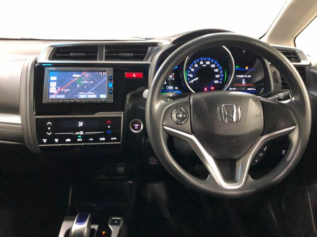 フィットハイブリッド Ｆパッケージ　走行５２４７１キロ／ワンセグナビ／バックカメラ　１年保証距離無制限　走行距離５２４７１キロ　ワンセグナビ　バックカメラ　ブルートゥース　純正マット　サイドエアバッグ　電動格納式ドアミラー　プッシュスタート（5枚目）