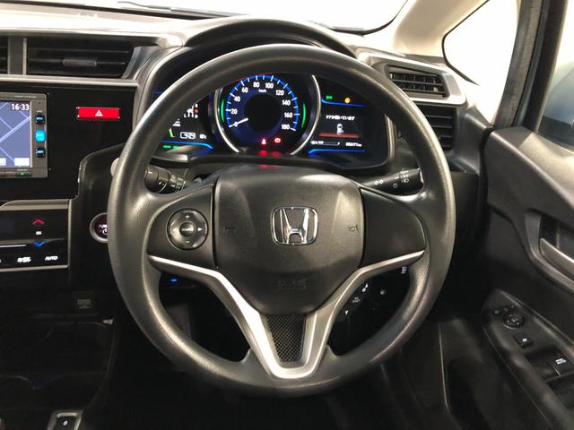 フィットハイブリッド Ｆパッケージ　走行５２４７１キロ／ワンセグナビ／バックカメラ　１年保証距離無制限　走行距離５２４７１キロ　ワンセグナビ　バックカメラ　ブルートゥース　純正マット　サイドエアバッグ　電動格納式ドアミラー　プッシュスタート（12枚目）