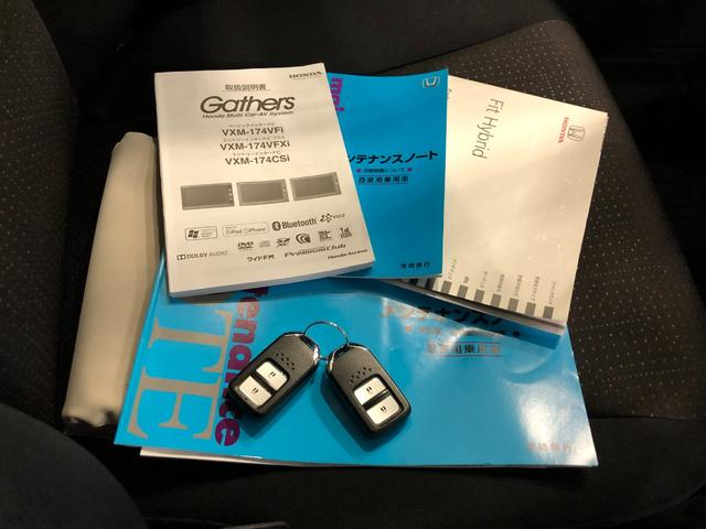 フィットハイブリッド Ｆパッケージ　走行５２４７１キロ／ワンセグナビ／バックカメラ　１年保証距離無制限　走行距離５２４７１キロ　ワンセグナビ　バックカメラ　ブルートゥース　純正マット　サイドエアバッグ　電動格納式ドアミラー　プッシュスタート（54枚目）