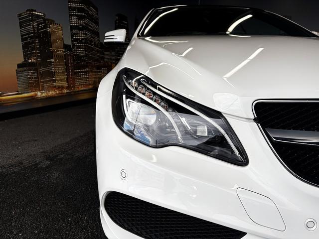 Eクラス E250カブリオレ AMGスポーツパッケージ(禁煙車)(後期型)(黒本革シート)(メーカーHDDナビ)(レーダークルーズ)(コーナーセンサー)(アラウンドビューモニター)(シートヒーター)(BSM)(純正18インチAW)(13枚目)