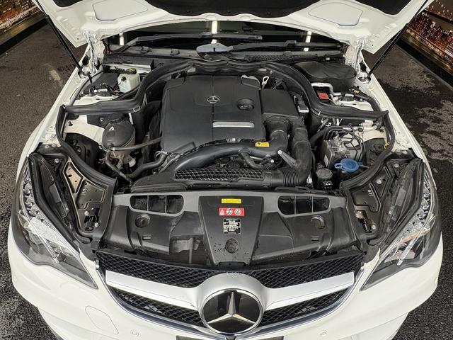 Eクラス E250カブリオレ AMGスポーツパッケージ(禁煙車)(後期型)(黒本革シート)(メーカーHDDナビ)(レーダークルーズ)(コーナーセンサー)(アラウンドビューモニター)(シートヒーター)(BSM)(純正18インチAW)(28枚目)