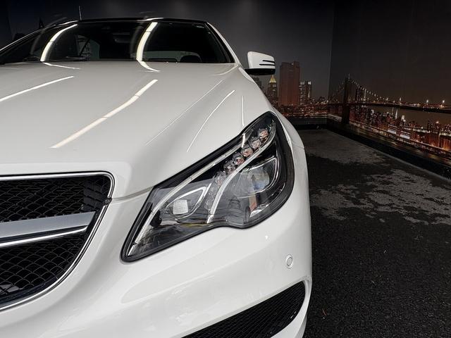 Eクラス E250カブリオレ AMGスポーツパッケージ(禁煙車)(後期型)(黒本革シート)(メーカーHDDナビ)(レーダークルーズ)(コーナーセンサー)(アラウンドビューモニター)(シートヒーター)(BSM)(純正18インチAW)(29枚目)