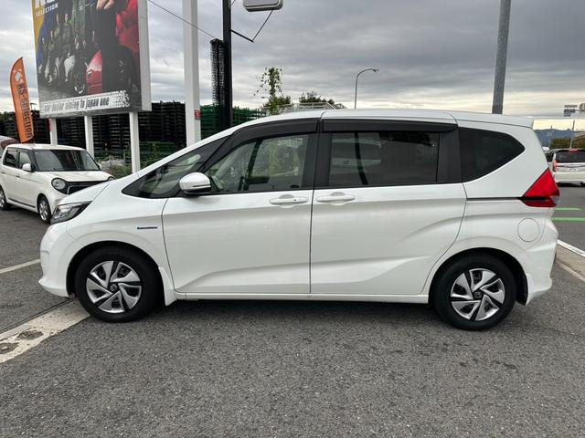 フリードハイブリッド ハイブリッド・Ｇホンダセンシング　両側電動スライドドア　クルーズコントロール　バックカメラ　Ｂｌｕｅｔｏｏｔｈオーディオ　　ＥＴＣ　ドライブレコーダー　オートライト　パワーウィンドウ　プッシュスタート　スマートキー（10枚目）