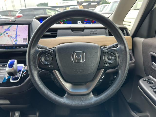 フリードハイブリッド ハイブリッド・Ｇホンダセンシング　両側電動スライドドア　クルーズコントロール　バックカメラ　Ｂｌｕｅｔｏｏｔｈオーディオ　　ＥＴＣ　ドライブレコーダー　オートライト　パワーウィンドウ　プッシュスタート　スマートキー（21枚目）