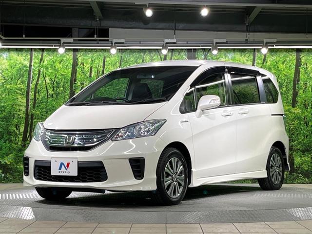 フリードハイブリッド ジャストセレクション 両側電動ドア 純正SDナビ バックカメラ 禁煙車 ハーフレザーシート スマートキー HIDヘッド ビルトインETC クルコン オートライト オートエアコン 純正15インチアルミ CD DVD再生(15枚目)