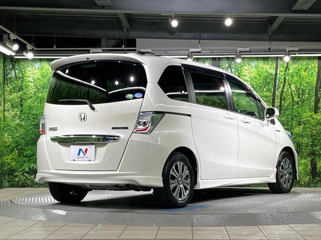 フリードハイブリッド ジャストセレクション 両側電動ドア 純正SDナビ バックカメラ 禁煙車 ハーフレザーシート スマートキー HIDヘッド ビルトインETC クルコン オートライト オートエアコン 純正15インチアルミ CD DVD再生(16枚目)