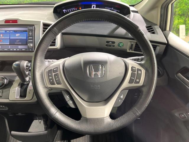 フリードハイブリッド ジャストセレクション 両側電動ドア 純正SDナビ バックカメラ 禁煙車 ハーフレザーシート スマートキー HIDヘッド ビルトインETC クルコン オートライト オートエアコン 純正15インチアルミ CD DVD再生(17枚目)