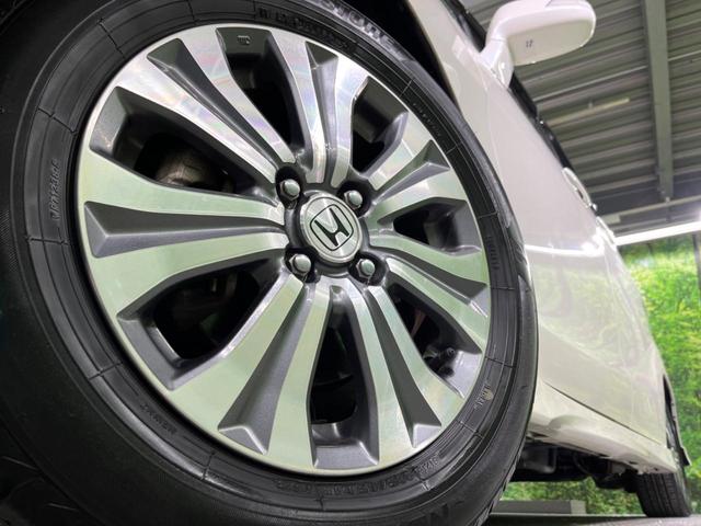 フリードハイブリッド ジャストセレクション 両側電動ドア 純正SDナビ バックカメラ 禁煙車 ハーフレザーシート スマートキー HIDヘッド ビルトインETC クルコン オートライト オートエアコン 純正15インチアルミ CD DVD再生(19枚目)