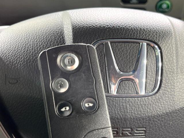 フリードハイブリッド ジャストセレクション 両側電動ドア 純正SDナビ バックカメラ 禁煙車 ハーフレザーシート スマートキー HIDヘッド ビルトインETC クルコン オートライト オートエアコン 純正15インチアルミ CD DVD再生(46枚目)