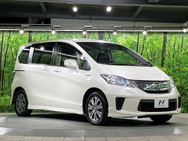 フリードハイブリッド ジャストセレクション 両側電動ドア 純正SDナビ バックカメラ 禁煙車 ハーフレザーシート スマートキー HIDヘッド ビルトインETC クルコン オートライト オートエアコン 純正15インチアルミ CD DVD再生(54枚目)