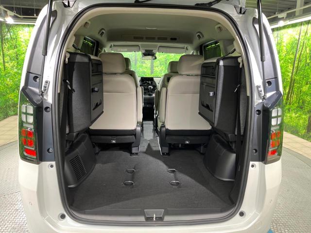 フリード ｅ：ＨＥＶエアー　ＥＸ　登録済未使用車　両側電動ドア　衝突被害軽減システム　レーダークルーズ　ハーフレザーシート　コーナーセンサー　スマートキー　純正１５インチアルミ　オートハイビーム　車線逸脱警報　オートライト（11枚目）