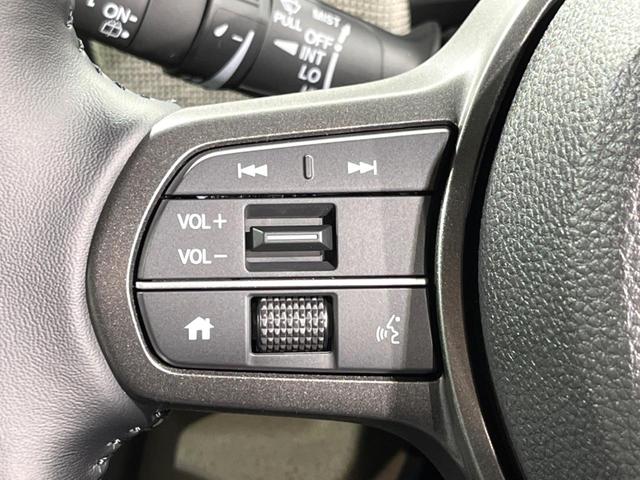 フリード ｅ：ＨＥＶエアー　ＥＸ　登録済未使用車　両側電動ドア　衝突被害軽減システム　レーダークルーズ　ハーフレザーシート　コーナーセンサー　スマートキー　純正１５インチアルミ　オートハイビーム　車線逸脱警報　オートライト（26枚目）