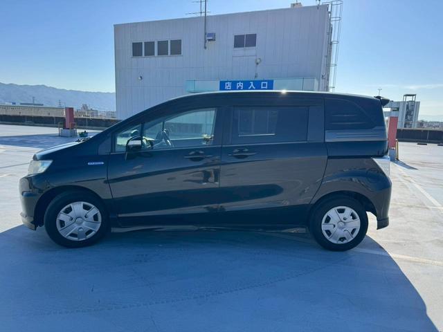 フリードハイブリッド 禁煙車・クルーズコントロール・BluetoothAudio対応・フルフラットシート・パワースライドドア・電動格納ミラー・ディスチャードランプ・ECONモードスイッチ(53枚目)