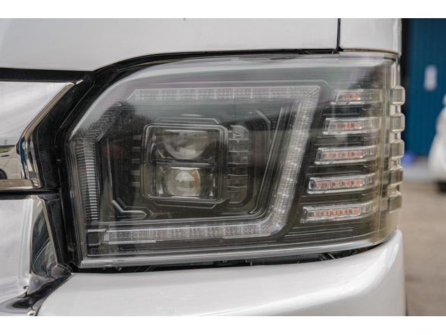 ハイエースバン スーパーＧＬ　ダークプライム　社外ナビ／フルゼク／バックカメラ／ＥＴＣ／ローダウン／エアロパーツ「フロント、リア、サイド」／デイトナホイール／ベッドキット／社外ヘッドライト／社外テールランプ／後席モニター／両側パワースライドドア（7枚目）