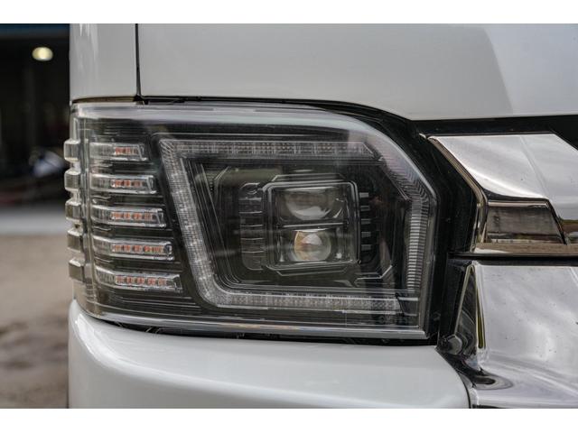 ハイエースバン スーパーＧＬ　ダークプライム　社外ナビ／フルゼク／バックカメラ／ＥＴＣ／ローダウン／エアロパーツ「フロント、リア、サイド」／デイトナホイール／ベッドキット／社外ヘッドライト／社外テールランプ／後席モニター／両側パワースライドドア（14枚目）