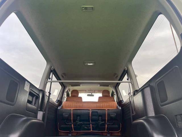 ハイエースバン ロングスーパーＧＬ　４型／プッシュスタートキー／ＬＥＤヘッドライト／社外ナビＴＶ／バックカメラ／ＥＴＣ／レザー調シートカバー／社外革巻ステアリング／社外テールレンズ／オートエアコン／車検整備付き（65枚目）