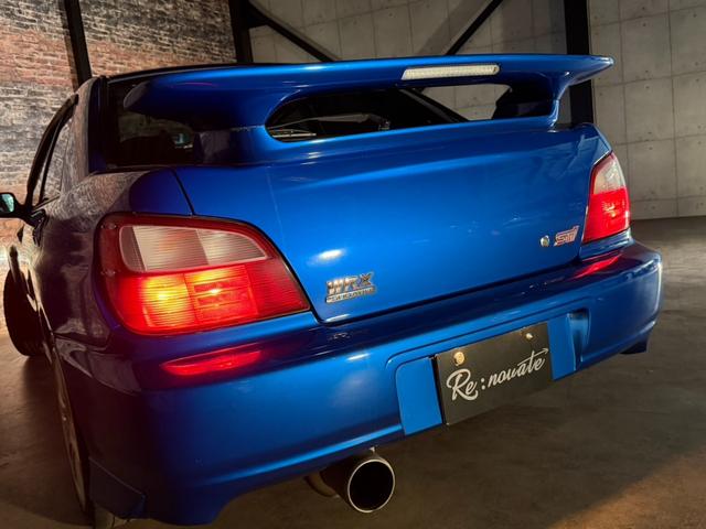 インプレッサ WRX STiリミテッド スバルAWD30周年記念モデル/Eg吸気効率UP/専用ECU/STIゲノムマフラー・3連追加メーター/リミテッド専用エアロパーツ/ファイナルスピード17AW/HDDナビ/CD/DVD/MD(5枚目)