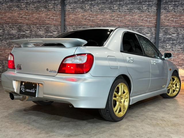インプレッサ WRX STi HKSリーガマックスマフラー/HKSブースト計/HDDナビ/ターボタイマー/ETC/HIDヘッドライト/純正17インチアルミ/リモコンキー/AWD/6速マニュアル/ボクサーサウンド(13枚目)