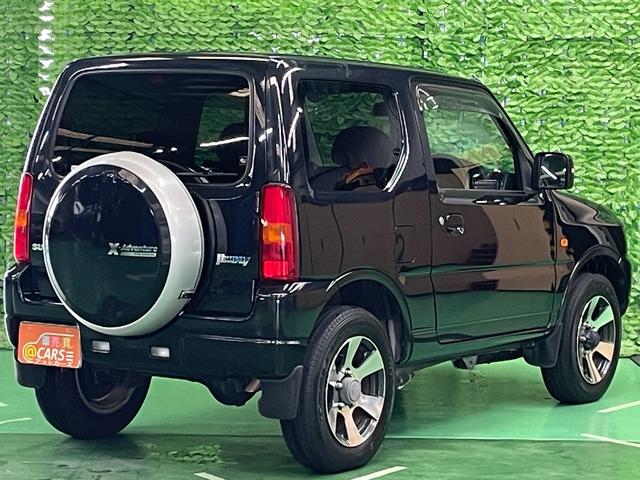 ジムニー クロスアドベンチャーＸＣ　パートタイム４ＷＤ　ターボチャージャー　ＦＭ／ＡＭラジオ　ＣＤ再生可　フォグランプ　キーレスエントリー　ハーフレザーシート　シートヒータ　純１６アルミ　電格ミラー　Ａ／Ｃ　本革ステア　禁煙　１オーナー（9枚目）