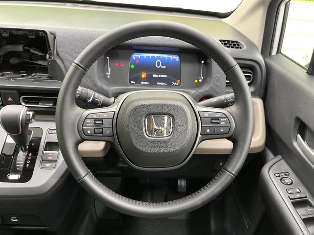 フリード エアー EX 登録済未使用車 両側電動ドア ホンダセンシング レーダークルーズ コーナーセンサー スマートキー LEDヘッド オートハイビーム 車線逸脱警報 オートライト オートエアコン 純正15インチアルミ(12枚目)