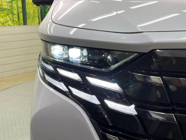 アルファード Z 左右独立ムーンルーフ 13.2型フリップダウンモニター 純正14型ナビ 全周囲カメラ デジタルインナーミラー 前中列シートエアコン 両側電動ドア 電動リアゲート 置くだけ充電 純正18インチアルミ(23枚目)