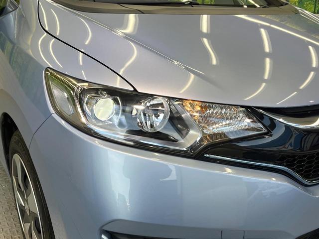 フィットハイブリッド Lパッケージ 純正ナビ バックカメラ 禁煙車 衝突軽減装置 クルーズコントロール LEDヘッド オートライト スマートキー 電動格納ミラー オートエアコン ドラレコ 純正革巻きステアリング ドアバイザー(12枚目)