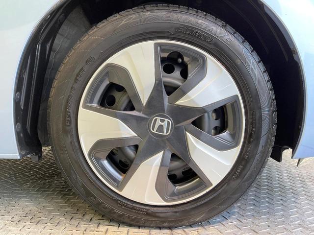 フィットハイブリッド Lパッケージ 純正ナビ バックカメラ 禁煙車 衝突軽減装置 クルーズコントロール LEDヘッド オートライト スマートキー 電動格納ミラー オートエアコン ドラレコ 純正革巻きステアリング ドアバイザー(64枚目)