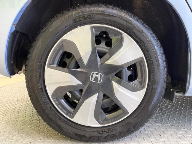 フィットハイブリッド Lパッケージ 純正ナビ バックカメラ 禁煙車 衝突軽減装置 クルーズコントロール LEDヘッド オートライト スマートキー 電動格納ミラー オートエアコン ドラレコ 純正革巻きステアリング ドアバイザー(65枚目)