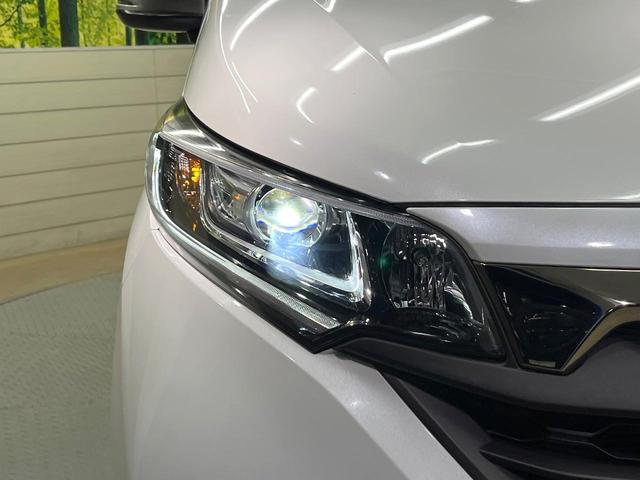 フリードハイブリッド ハイブリッド・クロスターホンダセンシング 両側電動ドア SDナビ バックカメラ 衝突被害軽減システム レーダークルーズ ハーフレザーシート スマートキー LEDヘッド ビルトインETC 車線逸脱警報 オートライト デュアルエアコン(21枚目)